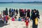 Muslim women and children spending holidays at the tropical beach