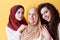 Muslim women in fashionable dress isolated on yellow