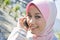Muslim young girl make a phone call