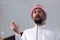 Muslims young arabic Imam has a speech on friday afternoon prayer in mosque. Muslims have gathered for the friday afternoon prayer