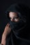 Muslin woman with black veil