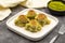 Mussel baklava. Pistachio baklava on a dark background. Mediterranean cuisine delicacies