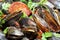 Mussels with chorizo and parsley with white smoke