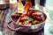 Mussels cooked with arrabiata sauce and served in metal pot, ton