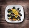 Mussels with green herbs and orange.