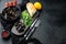 Mussels, molluscs, seaweed, sea plants with spices, in bowl, on black background , with copyspace  and space for text