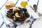 Mussels on a plate preparing with tymian and lemon
