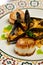 Mussels and scallops with spicy rice paella