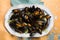 Mussels on a white plate, creamy mussels with English double cream sauce