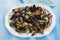 Mussels on a white plate, creamy mussels with English double cream sauce