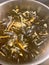 Mussels in white wine steaming and cooking in copper pot - top view