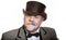 Mustache Man is an adult male artist in a business suit and a cylinder hat.