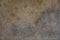 muted earth tones grunge and rough stucco wall background close up