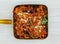 mutton karahi in a dish top view on grey background