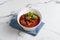 Mutton Rogan Josh, mutten qorma, mutten curry, mutton karahi in a dish isolated on napkin side view on grey background