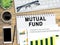 Mutual fund concept hand drawn on notebook.Business office desk desk concept