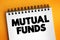 Mutual Funds - professionally managed investment fund that pools money from many investors to purchase securities, text concept on