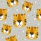 Muzzle of tigers, decorative cute background. Colorful seamless pattern with muzzles of animals