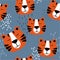 Muzzle of tigers, decorative cute background. Colorful seamless pattern with muzzles of animals