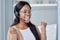 My boss just told me I have the promotion. Shot of an excited businesswoman sitting at her desk in her call center