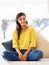 My day to take things easy. an attractive young woman relaxing on the sofa at home.