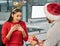 For my favourite coworker. Shot of a young businessman and businesswoman exchanging Christmas gifts in a modern office.