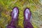 My feet in rubber boots, top view