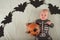 My first Halloween. Small child and pumpkin. Autumn concept, halloween, bats, pumpkins, newborn close-up and copy space