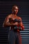 My focus is unmatched. Studio shot of an athletic young man working out using dumbbells against a grey background.