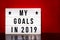 My goals 2019 sign - cinema style lettering on light box & warm red background