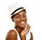 My look isnt complete without a hat. Studio shot of a fashionable young woman posing against a white background.