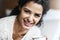 My mood is good thanks to this cuppa. Portrait of an attractive young woman relaxing at home with a cup of coffee.