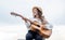 my new song. singer. happy teen girl playing guitar outdoor. happy childhood.