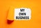 My own business symbol. Concept words My own business on beautiful white paper. Beautiful orange background. Business motivational