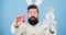 My precious. Funny bunny with beard and mustache hold pink egg. Easter symbol concept. Bearded man wear bunny ears. Egg