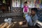 Myanmar - cat and child inside a tradicional home