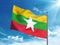 Myanmar flag waving in the blue sky