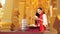 Myanmar women holding flowers at a temple. Southeast Asian young girls with burmese traditional dress visiting a Buddihist temple