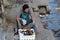 Myanmese male street vendor selling mangosteen beside the walkway at the Bogyoke Aung San Market or scott market, Yangon