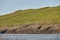 Mykines lighthouse andbirds on Faroe islands. Hiking landmark