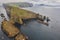 Mykines lighthouse and cliffs on Faroe islands from helicopter