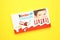 Mykolaiv, Ukraine - July 28, 2023: Kinder chocolate bars on yellow background.Kinder bars are produced by Ferrero founded in 1946