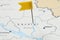 MYKOLAIV, UKRAINE - NOVEMBER 09, 2020: Contour map of Ukraine with flag push pin, closeup