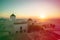 Mykonos, Greece. Sunset over the sea with iconic windmills of the Greek island of the Mikonos, seen from terrace