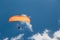 Myrtos Beach, Cephalonia island, Greece - July, 13 2019: Tandem paragliding against a blue sky on the Myrtos Beach coast