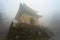 The mysterious ancient building complex of Wudang Mountain in the fog.