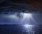 Mysterious  beams blue dark clouds on night sky at sea moonlight on water wave reflection nature seascape