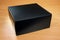 Mysterious black box on wood background