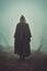 mysterious cloaked person walking down a fantasy misty path. medieval fantasy concept.