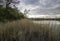 Mysterious dusk over a lake. Weather change - spring in Masurian Lake District. Poland.